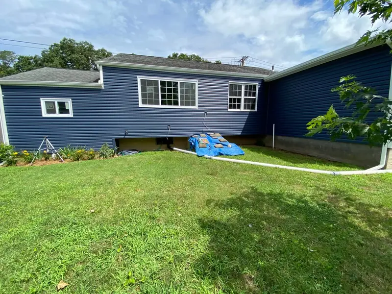 Rear of a ranch with new navy siding, Bay Shore, NY